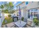 Backyard featuring a brick patio with a table set, umbrella, and fenced garden at 224 Je Edward Dr. # 17, Myrtle Beach, SC 29588