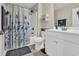 Bright bathroom with a shower-tub combination with floral shower curtain and tiled flooring at 224 Je Edward Dr. # 17, Myrtle Beach, SC 29588