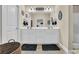 Neutral bathroom with double sinks, stylish lighting, and a large mirror at 224 Je Edward Dr. # 17, Myrtle Beach, SC 29588