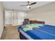 Comfortable bedroom features a ceiling fan, upholstered chair, and dresser with drawers at 224 Je Edward Dr. # 17, Myrtle Beach, SC 29588