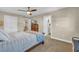 Comfortable bedroom featuring natural light, ceiling fan, and access to the ensuite bathroom at 224 Je Edward Dr. # 17, Myrtle Beach, SC 29588
