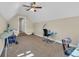 Neutral bonus room with seating, desk, ceiling fan and an ironing board at 224 Je Edward Dr. # 17, Myrtle Beach, SC 29588