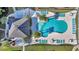 Aerial view of community pool featuring abundant seating, palm trees and clubhouse at 224 Je Edward Dr. # 17, Myrtle Beach, SC 29588