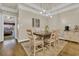 Cozy dining area featuring a wooden table, six chairs, and modern pendant lighting at 224 Je Edward Dr. # 17, Myrtle Beach, SC 29588