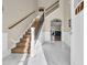 Inviting foyer with marble floors, elegant staircase with iron spindles, and arched doorway at 224 Je Edward Dr. # 17, Myrtle Beach, SC 29588