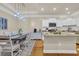 Spacious kitchen with granite counters, white cabinets, and an island; open to the dining area at 224 Je Edward Dr. # 17, Myrtle Beach, SC 29588