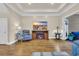 Bright living room featuring a fireplace, hardwood floors, tray ceiling and a walkout to a screened porch at 224 Je Edward Dr. # 17, Myrtle Beach, SC 29588
