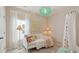 Cozy bedroom featuring a unique chandelier, plush bedding, and a decorative canopy at 224 Warner Crossing Way, Loris, SC 29569