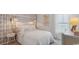 Serene bedroom with patterned wallpaper, stylish lighting, and a comfortable bed at 224 Warner Crossing Way, Loris, SC 29569