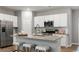 Well-equipped kitchen with stainless steel appliances, white cabinets, and granite countertops at 224 Warner Crossing Way, Loris, SC 29569