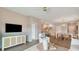 Open-concept living space boasts views of the kitchen and dining area, promoting a modern and airy feel at 224 Warner Crossing Way, Loris, SC 29569