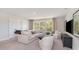 Bright living room with neutral tones, large windows, and comfortable seating creates a welcoming atmosphere at 305 Glacier Way, Conway, SC 29526