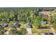 House on a secluded lot. The surrounding area is lush with tall green trees at 3096 Hugo Rd., Conway, SC 29527