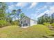 The backyard patio features comfortable seating and a grill, providing a relaxing outdoor space at 3096 Hugo Rd., Conway, SC 29527
