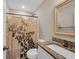 Bathroom with granite countertop vanity and shower with decorative curtain at 3096 Hugo Rd., Conway, SC 29527