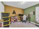 Bedroom with window, gaming setup, and yarn decorations at 3096 Hugo Rd., Conway, SC 29527