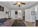 Comfortable bedroom with ceiling fan, view to the en-suite, and ample natural light at 3096 Hugo Rd., Conway, SC 29527