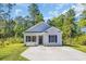 Welcoming single story home with a neat lawn and a long driveway offering convenient off-street parking at 3096 Hugo Rd., Conway, SC 29527
