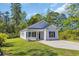 Charming single story home boasts manicured lawn and a long driveway for ample parking at 3096 Hugo Rd., Conway, SC 29527