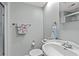 This bathroom includes a large sink and shower with glass door at 319 Sparrow Dr., Surfside Beach, SC 29575