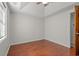 Bright bedroom features wood floors and a ceiling fan at 319 Sparrow Dr., Surfside Beach, SC 29575