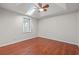 This bedroom has wood floors, a ceiling fan, and a skylight at 319 Sparrow Dr., Surfside Beach, SC 29575