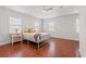 Spacious bedroom featuring hard wood floors, modern bedframe, and bright windows at 319 Sparrow Dr., Surfside Beach, SC 29575