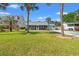 Charming home with a long driveway, garage, a metal roof and palm trees at 319 Sparrow Dr., Surfside Beach, SC 29575