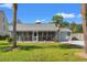 Well-maintained home with a garage, screened porch, and an American flag waving proudly at 319 Sparrow Dr., Surfside Beach, SC 29575