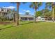 Charming home with well-maintained lawn and palm trees creating a tropical paradise feel at 319 Sparrow Dr., Surfside Beach, SC 29575