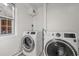 Laundry room featuring modern, front-loading washer and dryer at 319 Sparrow Dr., Surfside Beach, SC 29575
