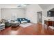 Inviting living room with hardwood floors, a blue sectional sofa, and vaulted ceilings at 319 Sparrow Dr., Surfside Beach, SC 29575