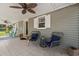 Relaxing screened-in porch with comfortable seating, perfect for enjoying the outdoors at 319 Sparrow Dr., Surfside Beach, SC 29575