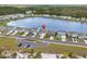 Expansive aerial view of a lakeside community, featuring well-maintained homes and a central lake at 3549 Bells Lake Circle, Longs, SC 29568