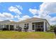 View of backyard featuring patio, grill, screened-in porch, and fenced perimeter at 3549 Bells Lake Circle, Longs, SC 29568