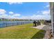 Landscaped backyard with lake view, patio, and outdoor grill at 3549 Bells Lake Circle, Longs, SC 29568