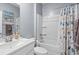 Bright bathroom featuring a shower with a stylish curtain, light blue walls, and a large single sink vanity at 3549 Bells Lake Circle, Longs, SC 29568