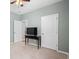 Bright bedroom featuring neutral walls, a stylish black media console, and a ceiling fan at 3549 Bells Lake Circle, Longs, SC 29568