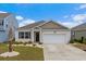 Inviting single-Gathering home featuring a manicured lawn, a two-car garage, and a welcoming front entrance at 3549 Bells Lake Circle, Longs, SC 29568