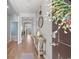 Bright foyer with hardwood floors, a decorative console table, and an inviting entryway with a decorated wreath at 3549 Bells Lake Circle, Longs, SC 29568