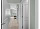 Hallway view leading into bedroom featuring carpet and light blue walls at 3549 Bells Lake Circle, Longs, SC 29568