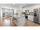 Open concept kitchen features granite counters, stainless steel appliances and a view to the dining area at 3549 Bells Lake Circle, Longs, SC 29568