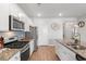 Kitchen with stainless steel appliances and tile backsplash at 3549 Bells Lake Circle, Longs, SC 29568