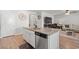 Kitchen island with granite countertops and stainless steel dishwasher in open concept living area at 3549 Bells Lake Circle, Longs, SC 29568