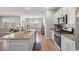 Open kitchen with view to dining area, kitchen island, and living room at 3549 Bells Lake Circle, Longs, SC 29568