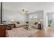 Bright, spacious living room with large windows offering lake views, complemented by stylish furnishings at 3549 Bells Lake Circle, Longs, SC 29568