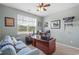 A well-decorated office space offering a comfortable sofa and a spacious desk at 3549 Bells Lake Circle, Longs, SC 29568