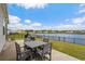 Outdoor patio featuring a grill and a dining set with lovely waterfront views at 3549 Bells Lake Circle, Longs, SC 29568