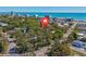 An aerial view of the property nestled amongst trees, showcasing its location near the beach and local streets at 4520 Hedrick St., North Myrtle Beach, SC 29582