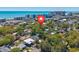 An aerial view highlights the property's proximity to the beach, surrounded by lush greenery and neighborhood charm at 4520 Hedrick St., North Myrtle Beach, SC 29582